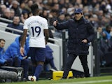 Tottenham Hotspur's Ryan Sessegnon walks off the pitch after being substituted as manager Antonio Conte looks on on February 13, 2022