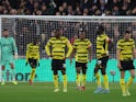 Watford players look dejected after West Ham United's first goal on February 8, 2022