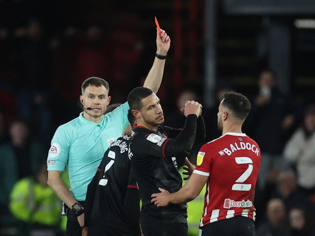 West Brom Albion's Jake Livermore is shown a red card by referee Leigh Doughty on February 9, 2022