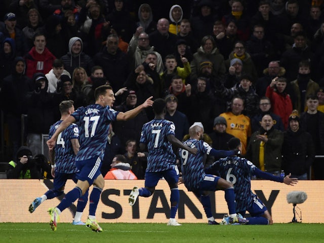 Arsenal's Gabriel celebrates scoring their first goal with Alexandre Lacazette, Bukayo Saka, Cedric Soares and Ben White on February 10, 2022