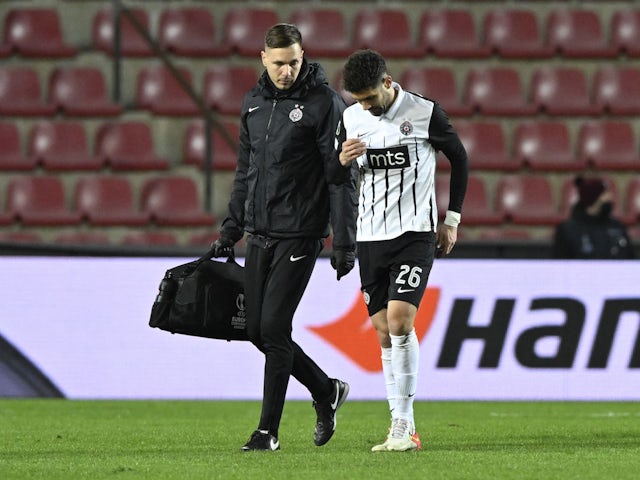 Partizan Belgrade's Aleksandar Miljkovic leaves the pitch after sustaining an injury on February 17, 2022