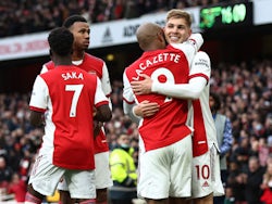 Arsenal's Emile Smith Rowe celebrates scoring their first goal with Alexandre Lacazette and teammates on February 19, 2022