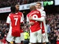 Arsenal's Emile Smith Rowe celebrates scoring their first goal with Alexandre Lacazette and teammates on February 19, 2022