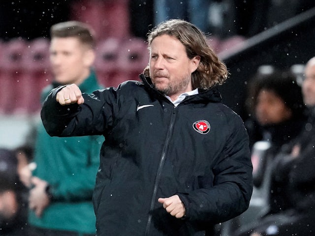 FC Midtjylland coach Bo Henriksen celebrates their first goal scored by Joel Andersson on February 17, 2022