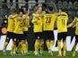 Borussia Dortmund's Donyell Malen celebrates scoring their second goal with Julian Brandt, Emre Can, Marco Reus and teammates on February 20, 2022