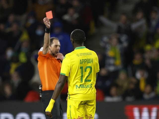 Nantes' Dennis Appiah is shown a red card by referee Mikael Lesage on February 19, 2022