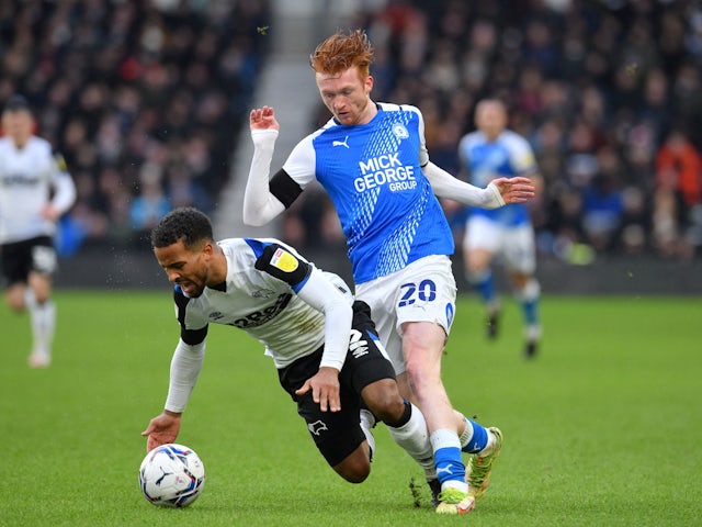 Derby County's Nathan Byrne in action with Peterborough United's Callum Morton on February 19, 2022