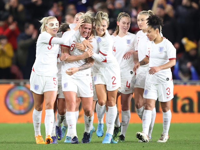 England Women's Millie Bright celebrates scoring their first goal with teammates on February 17, 2022