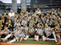 Atletico Mineiro players celebrate with the trophy after winning the final on February 20, 2022