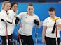 Skip Eve Muirhead of Britain, Vice Vicky Wright of Britain, Jennifer Dodds of Britain and Hailey Duff of Britain watch the play on February 16, 2022