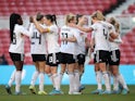 Germany Women's Lea Schuller celebrates scoring their first goal with teammates on February 17, 2022