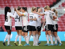 Germany Women's Lea Schuller celebrates scoring their first goal with teammates on February 17, 2022