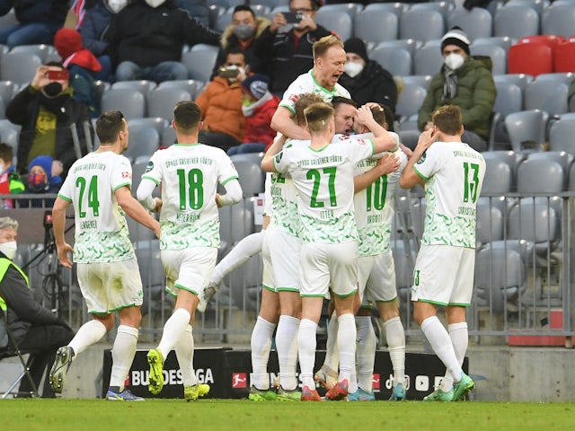 Greuther Fuerth's Branimir Hrgota celebrates scoring their first goal with teammates on February 20, 2022