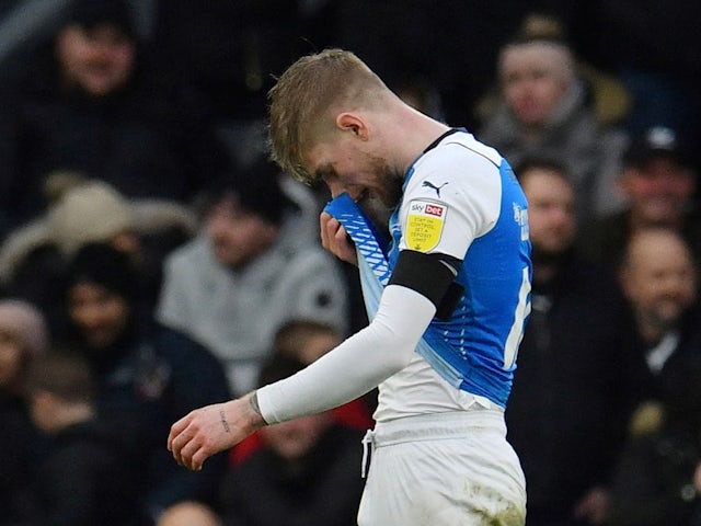 Peterborough United's Hayden Coulson looks dejected after he was shown a red card on February 19, 2022