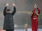 Jurgen Klopp and Jordan Henderson celebrating Liverpool's Champions League win over Inter Milan on February 16, 2022.