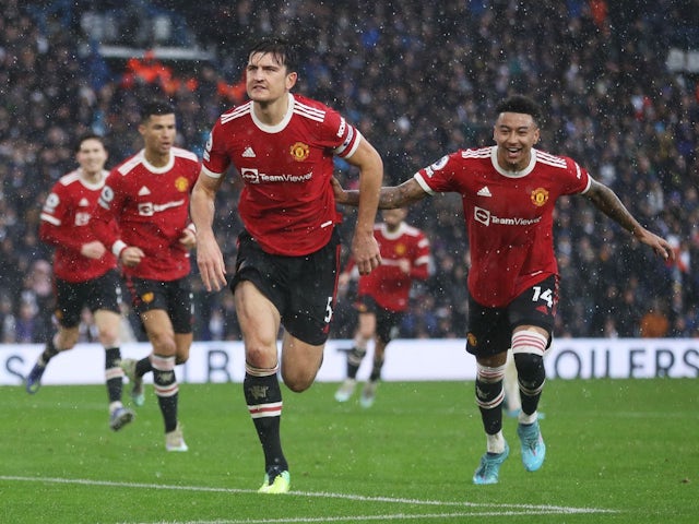 Manchester United's Harry Maguire celebrates scoring their first goal with Jesse Lingard on February 20, 2022
