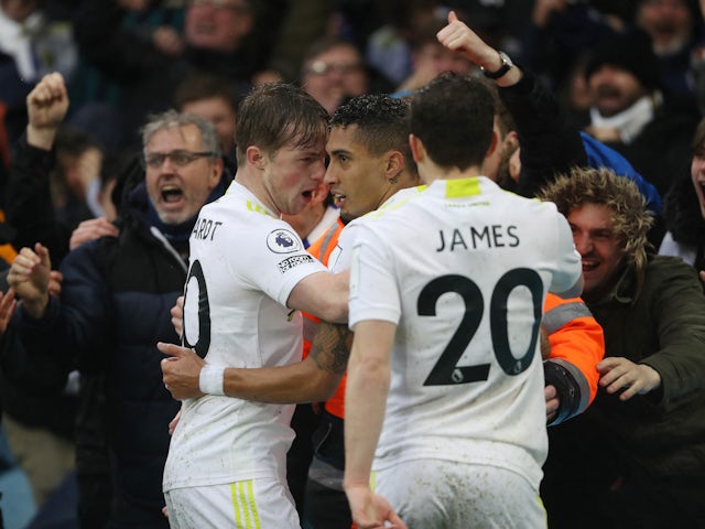 Leeds United's Raphinha celebrates scoring their second goal with Joe Gelhardt and Daniel James on February 20, 2022