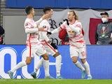 RB Leipzig's Emil Forsberg celebrates scoring their second goal with teammates on February 17, 2022