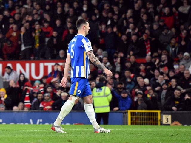 Brighton & Hove Albion's Lewis Dunk walks off the pitch dejected after being shown a red card on February 15, 2022