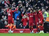 Liverpool's Mohamed Salah celebrates scoring their second goal with teammates on February 19, 2022