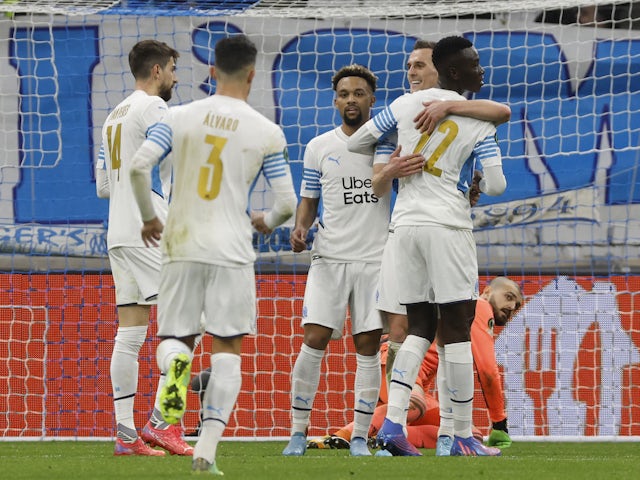 Marseille's Arkadiusz Milik celebrates scoring their second goal with teammates on February 17, 2022