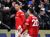 Manchester United's Cristiano Ronaldo celebrates scoring their first goal with Diogo Dalot on February 15, 2022