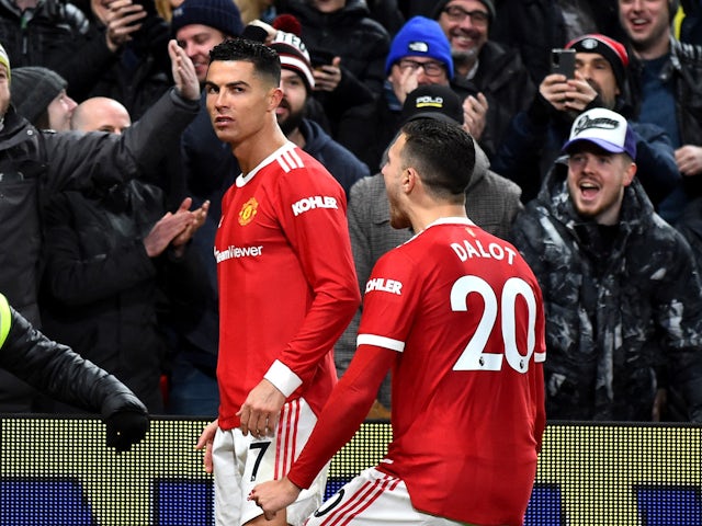 Manchester United's Cristiano Ronaldo celebrates scoring their first goal with Diogo Dalot on February 15, 2022
