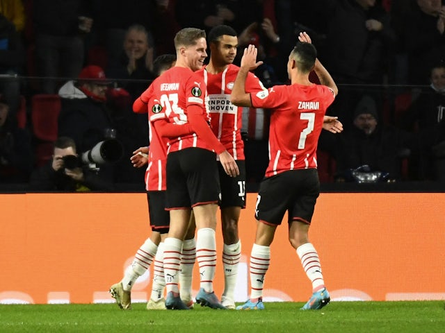 PSV Eindhoven's Cody Gakpo celebrates scoring their first goal with teammates on February 17, 2022
