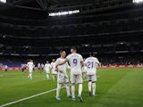 Real Madrid's Karim Benzema celebrates scoring their third goal with Lucas Vazquez on February 19, 2022