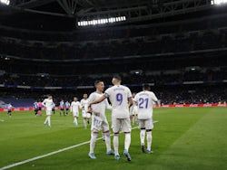 Real Madrid's Karim Benzema celebrates scoring their third goal with Lucas Vazquez on February 19, 2022