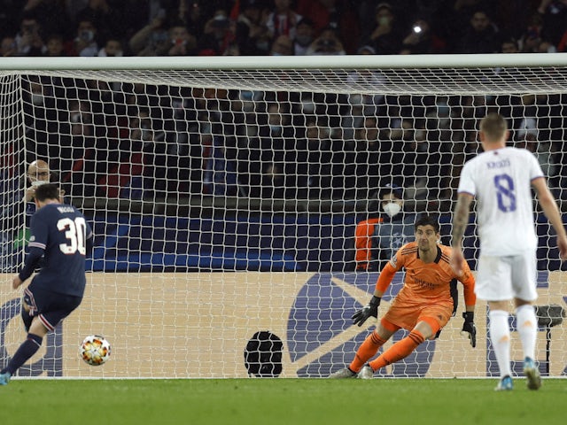 Real Madrid's Thibaut Courtois saves a penalty from Paris Saint-Germain's (PSG) Lionel Messi on February 15, 2022