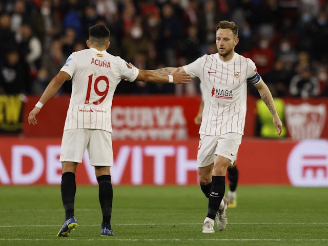 Sevilla's Ivan Rakitic celebrates scoring their first goal with Marcos Acuna on February 17, 2022