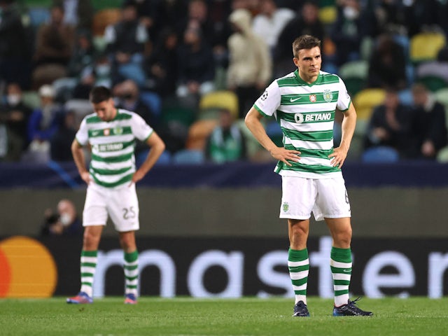 Sporting Lisbon's Joao Palhinha looks dejected after Manchester City's Bernardo Silva scored his fourth goal on February 15, 2022