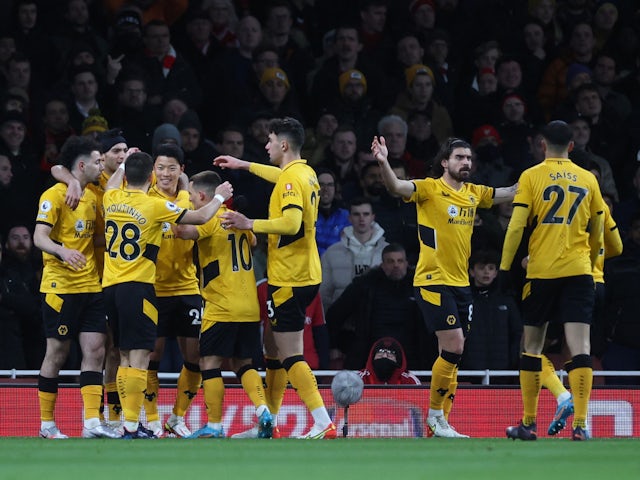 Wolverhampton Wanderers' Hwang Hee-Chan celebrates scoring their first goal with teammates on February 24, 2022