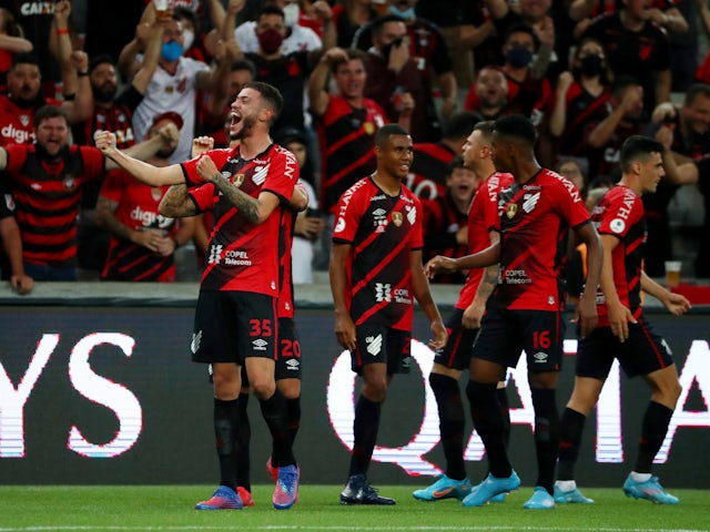 Terans of Athletico Paranaense celebrate scoring their first goal with their teammates on February 23, 2022