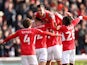 Barnsley's Amine Bassi celebrates scoring their second goal with teammates on February 26, 2022