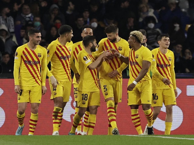 Barcelona's Gerard Pique celebrates scoring their third goal with teammates on February 24, 2022