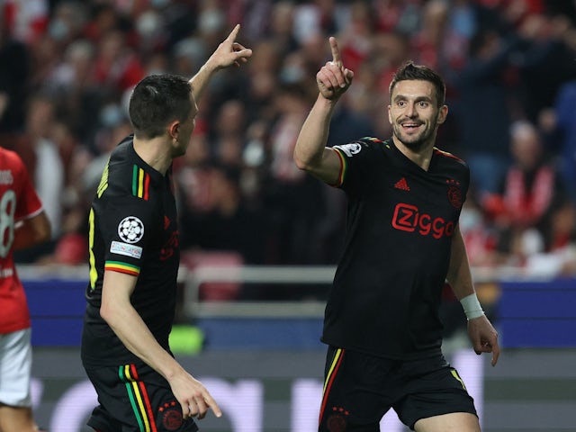 Ajax Amsterdam's Dusan Tadic celebrates scoring their first goal with Steven Berghuis on February 23, 2022