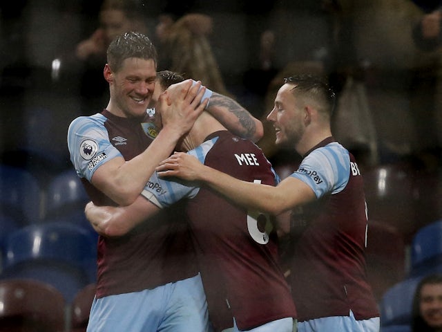 Burnley's Ben Mee celebrates scoring their first goal with Wout Weghorst and Josh Brownhill on February 23, 2022