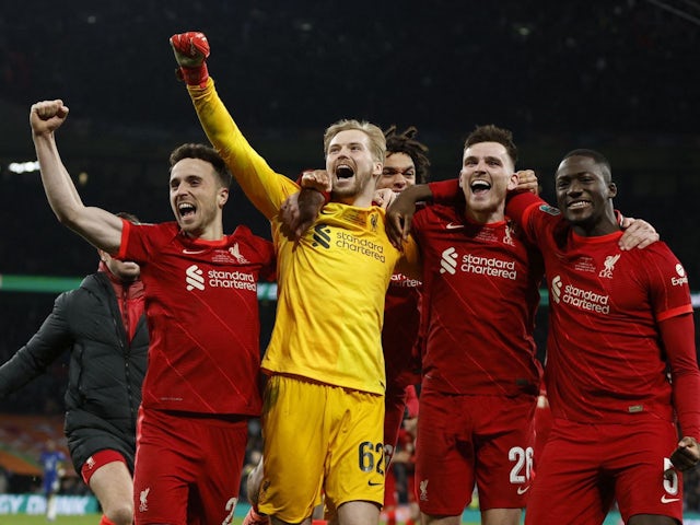 Caoimhin Kelleher celebrates with teammates after Liverpool win the EFL Cup on February 27, 2022