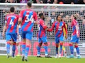 Crystal Palace's Michael Olise celebrates scoring their second goal with Jeffrey Schlupp and Conor Gallagher on February 26, 2022