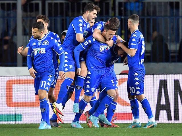 Empoli's Szymon Zurkowski celebrates scoring their first goal with teammates on February 26, 2022