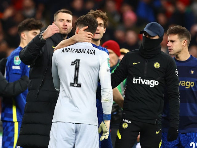 Kepa Arrizabalaga is consoled by Chelsea teammates on February 27, 2022