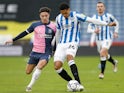 Huddersfield Town's Levi Colwill and Coventry City's Callum O'Hare in action on December 11, 2021 