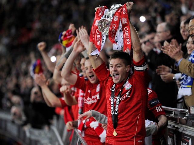 Liverpool celebrate winning the 2011-12 EFL Cup in February 2012
