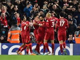 Liverpool's Mohamed Salah celebrates scoring their first goal with teammates on February 23, 2022