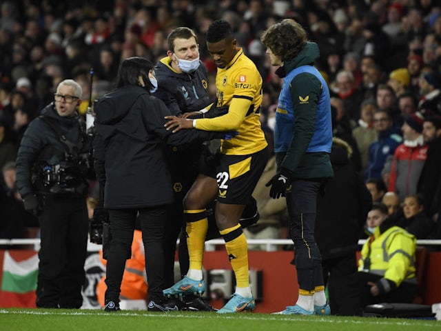 Wolverhampton Wanderers' Nelson Semedo with the medical team after sustaining an injury on February 24, 2022