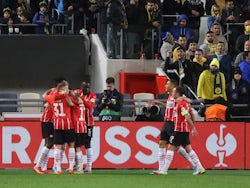 PSV Eindhoven's Yorbe Vertessen celebrates scoring their first goal with teammates on February 24, 2022