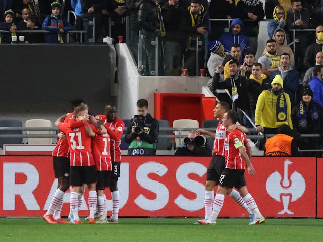PSV Eindhoven's Yorbe Vertessen celebrates scoring their first goal with teammates on February 24, 2022