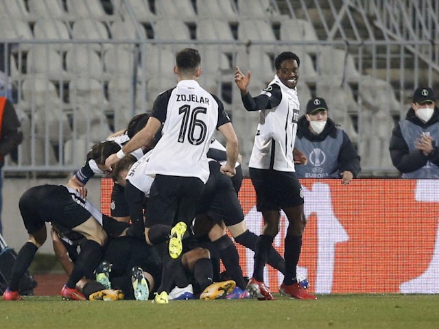 Partizan Belgrade's Ricardo Gomes celebrates scoring their first goal with teammates on February 24, 2022